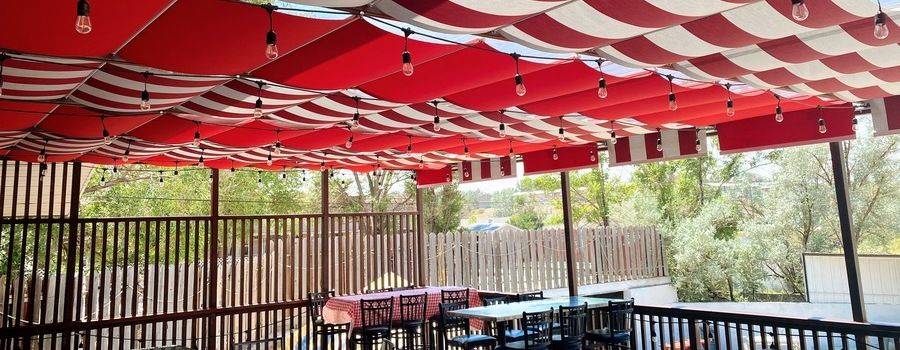 Solid and Striped Waterproof Sunbrella Fabrics Used for Retractable Awnings on Cables